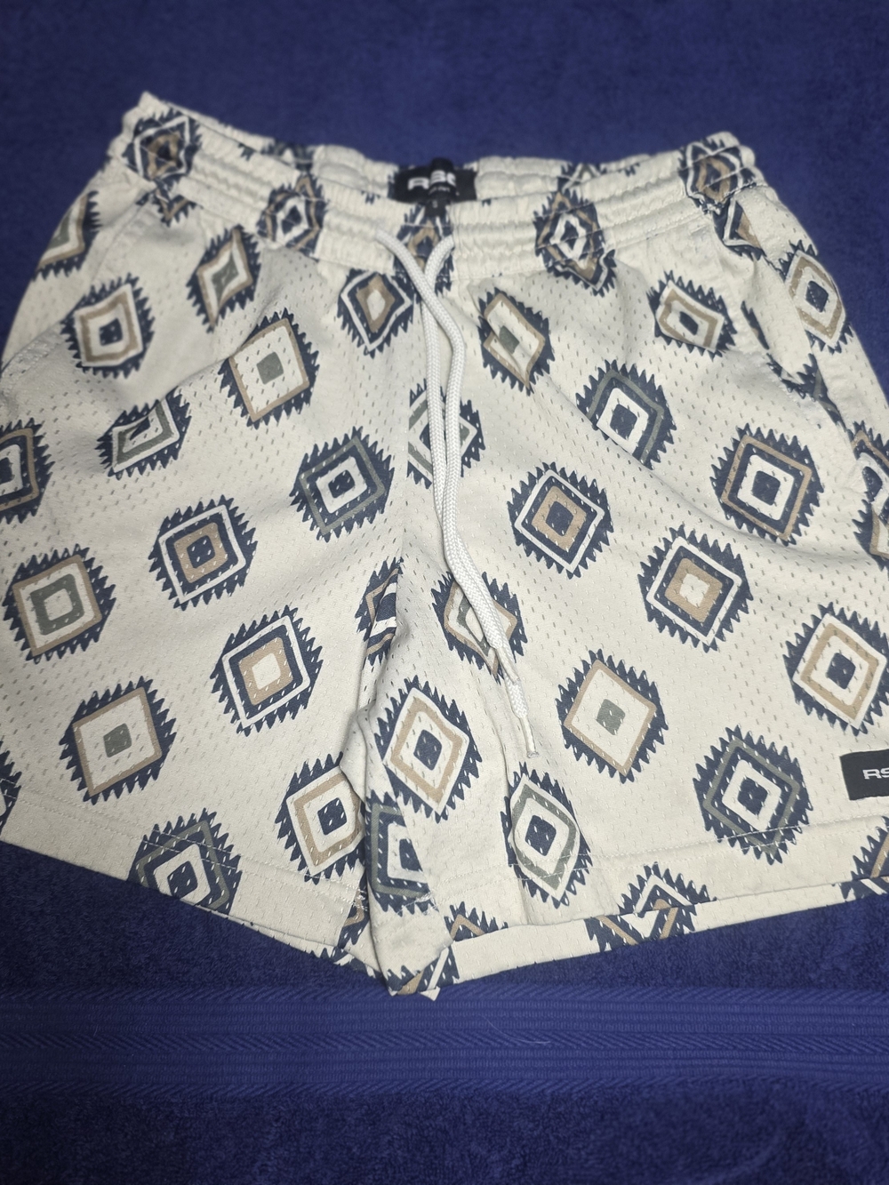 RSQ Cream Athletic Swim Shorts with Blue and Tan Geometric Print